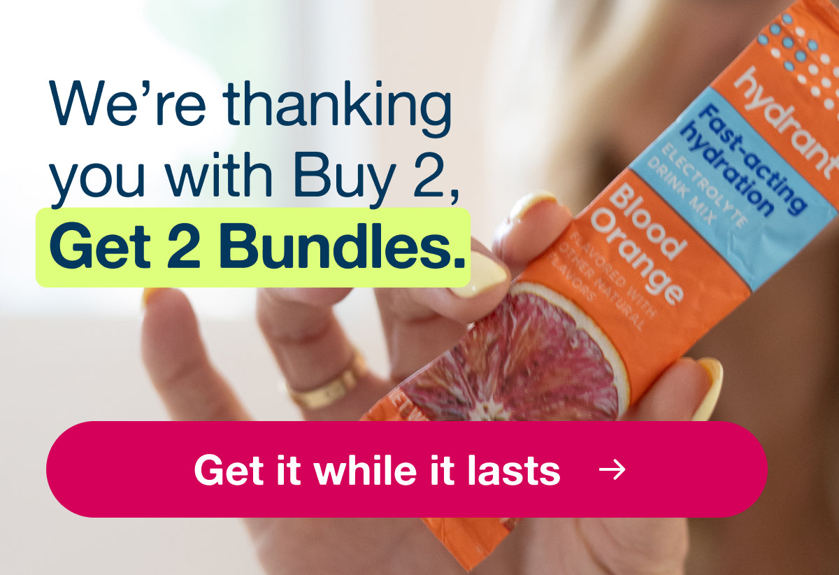 Woman holding Hydrant Blood Orange electrolyte packet